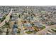 Aerial view shows house in a neighborhood surrounded by tree-lined streets and residential homes at 598 Arden Cir, Highlands Ranch, CO 80126