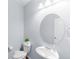Clean, updated half-bathroom with modern fixtures and a simple, elegant design at 10569 Racine St, Commerce City, CO 80022