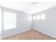 Bright bedroom with carpet flooring and natural light from three windows at 10569 Racine St, Commerce City, CO 80022
