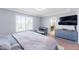 Bedroom with a TV, desk, dresser, carpet, and a window for natural light at 10569 Racine St, Commerce City, CO 80022