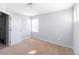 Bright bedroom with neutral carpet and natural light from the window at 10569 Racine St, Commerce City, CO 80022