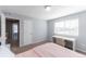 Bright bedroom with carpet flooring, window, desk, and fresh paint at 10569 Racine St, Commerce City, CO 80022