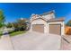 Charming home with a two-car garage and a well-maintained lawn on a beautiful sunny day at 10569 Racine St, Commerce City, CO 80022