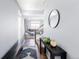 Inviting hallway with hardwood floors, modern decor, and a view into the living space at 10569 Racine St, Commerce City, CO 80022