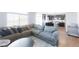 Open-concept living room flowing into a modern kitchen, perfect for entertaining at 10569 Racine St, Commerce City, CO 80022
