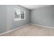 Bedroom with neutral carpet and a window for natural light at 18103 E Kentucky Ave # 103, Aurora, CO 80017