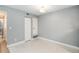 Bedroom featuring tile flooring, fresh paint, and ample closet space at 18103 E Kentucky Ave # 103, Aurora, CO 80017