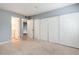 Bedroom with carpet, a closet and views to the bathroom and hallway at 18103 E Kentucky Ave # 103, Aurora, CO 80017