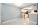 Eat-in kitchen with white cabinets and stainless steel appliances at 18103 E Kentucky Ave # 103, Aurora, CO 80017