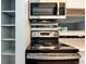 Close-up of stainless steel stove and microwave combination at 18103 E Kentucky Ave # 103, Aurora, CO 80017
