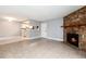 View of living room showcasing fireplace and open access to the kitchen at 18103 E Kentucky Ave # 103, Aurora, CO 80017