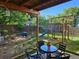 Charming backyard with a covered patio, play structure, and a serene outdoor setting at 2034 S Truckee St, Aurora, CO 80013