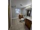 Cozy bathroom with a tiled floor and warm-toned cabinets at 2034 S Truckee St, Aurora, CO 80013