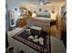 Comfortable bedroom featuring neutral color palette, wood furniture set, and ceiling fan at 2034 S Truckee St, Aurora, CO 80013