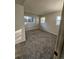 Neutral bedroom featuring plush carpeting and three windows at 2034 S Truckee St, Aurora, CO 80013