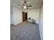 Clean, bright bedroom featuring neutral walls, ceiling fan, and modern desk at 2034 S Truckee St, Aurora, CO 80013