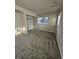 Carpeted bedroom with a walk-in closet and natural light at 2034 S Truckee St, Aurora, CO 80013