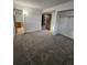 Spacious carpeted bedroom with closet and bathroom access, ready for personalization at 2034 S Truckee St, Aurora, CO 80013