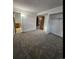 Bright bedroom with neutral walls, plush carpet, and a convenient closet at 2034 S Truckee St, Aurora, CO 80013
