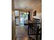 Dining room with wood table, chandelier, and sliding door access to the backyard at 2034 S Truckee St, Aurora, CO 80013