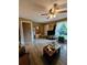 Comfortable living room with hardwood floors, ceiling fan, and a large window at 2034 S Truckee St, Aurora, CO 80013