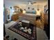 Comfortable main bedroom with wood furniture and carpet, ready for relaxation at 2034 S Truckee St, Aurora, CO 80013