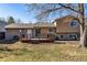 The backyard features a wooden deck, grassy area and provides ample space for outdoor activities at 16277 E Arkansas Dr, Aurora, CO 80017