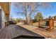 The backyard features a wooden deck and a spacious grassy area at 16277 E Arkansas Dr, Aurora, CO 80017