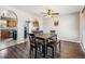A formal dining room with modern hardwood floors and easy kitchen access at 16277 E Arkansas Dr, Aurora, CO 80017