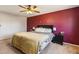 Bright main bedroom featuring ceiling fan, and dark wood furniture at 16277 E Arkansas Dr, Aurora, CO 80017