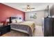 Comfortable main bedroom with ceiling fan, TV, and ample closet space at 16277 E Arkansas Dr, Aurora, CO 80017