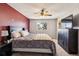 Comfortable main bedroom with ceiling fan, TV, and ample closet space at 16277 E Arkansas Dr, Aurora, CO 80017