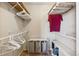A walk-in closet featuring built-in shelving and hanging space, offering ample storage solutions for clothing and accessories at 16277 E Arkansas Dr, Aurora, CO 80017
