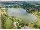 Aerial view of the community with large lake and plentiful green trees at 1536 S Field Ct, Lakewood, CO 80232