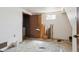 Unfinished basement with washer and dryer hookups and small window at 1536 S Field Ct, Lakewood, CO 80232