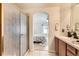 Bathroom showcasing a walk-in shower and a sink in the background at 2444 S Scranton Way, Aurora, CO 80014