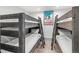 Cozy bedroom featuring two sets of dark wood bunkbeds, perfect for and ski decor at 112 Illinois Gulch Rd # 6, Breckenridge, CO 80424