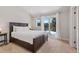 Bedroom featuring a large bed, windows, and view of a snowy mountain landscape at 112 Illinois Gulch Rd # 6, Breckenridge, CO 80424