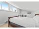 This bedroom features a sloped ceiling, two windows, and a partial view of a staircase at 112 Illinois Gulch Rd # 6, Breckenridge, CO 80424