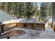 Wintery deck overlooking a snowy landscape at 112 Illinois Gulch Rd # 6, Breckenridge, CO 80424