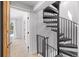 Hallway with an open doorway and spiral staircase at 112 Illinois Gulch Rd # 6, Breckenridge, CO 80424