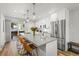 Contemporary kitchen featuring stainless appliances, island with barstool seating and patio doors at 112 Illinois Gulch Rd # 6, Breckenridge, CO 80424