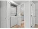 Convenient laundry closet, bathroom, and doorways in this well-lit hallway with carpet and bathroom flooring at 112 Illinois Gulch Rd # 6, Breckenridge, CO 80424