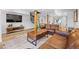 Inviting living room with wood floors, leather furniture and a modern staircase at 112 Illinois Gulch Rd # 6, Breckenridge, CO 80424