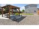 Relax in this backyard oasis featuring a charming pergola and lush landscaping, perfect for outdoor entertaining and relaxation at 25106 E 1St Ave, Aurora, CO 80018