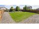 Backyard featuring a well-maintained lawn, gazebo, and surrounding rock landscaping at 25106 E 1St Ave, Aurora, CO 80018