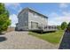A gray home with a large deck in the backyard perfect for entertaining at 25106 E 1St Ave, Aurora, CO 80018