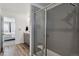 Modern bathroom features a glass shower enclosure and access to the main bedroom area at 25106 E 1St Ave, Aurora, CO 80018