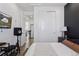 Bedroom featuring a TV, closet, and stylish decor, offers comfort and functionality, perfect for relaxation and entertainment at 25106 E 1St Ave, Aurora, CO 80018