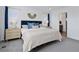 Comfortable bedroom with gray carpet, with a view to the ensuite bath at 25106 E 1St Ave, Aurora, CO 80018